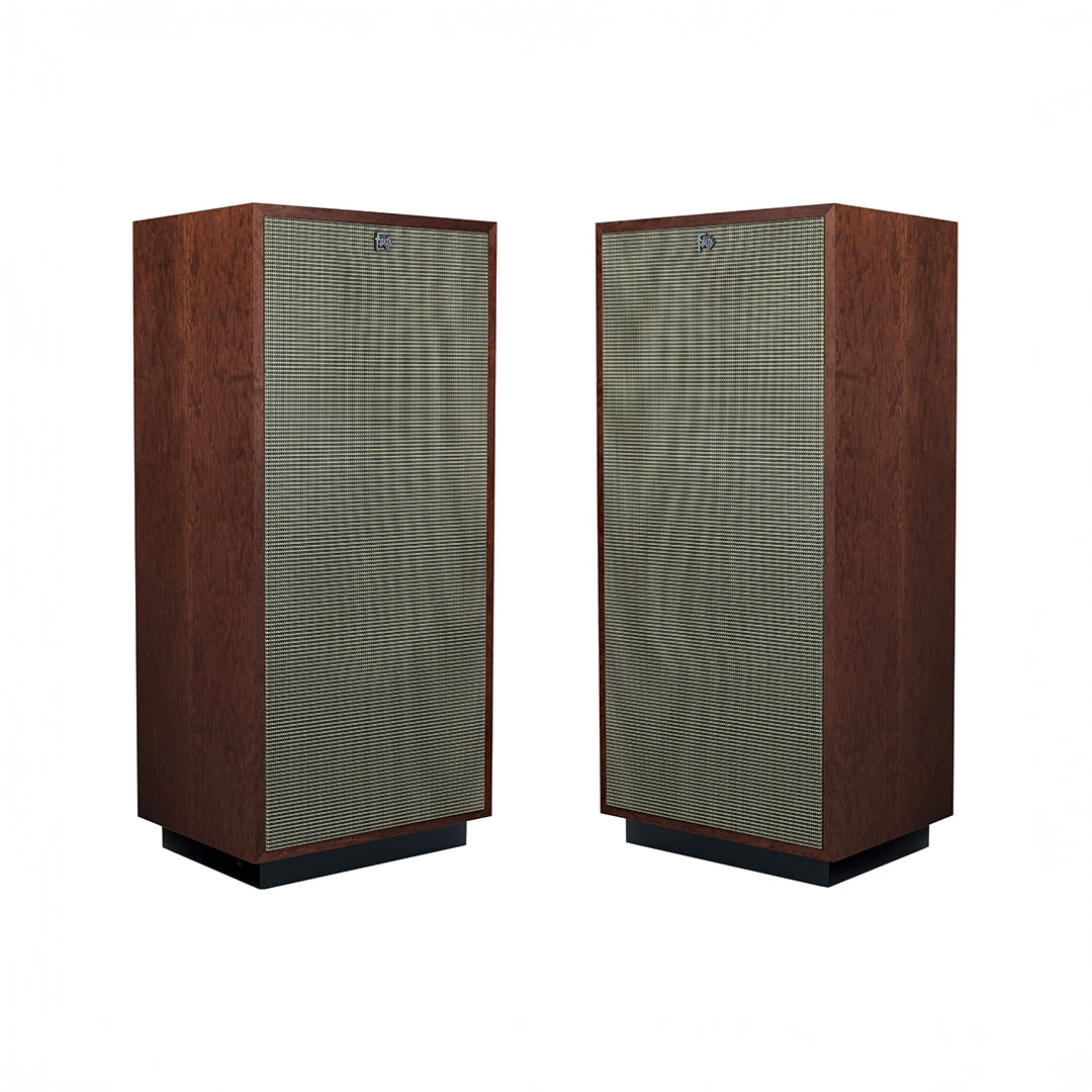 Two vintage wooden speakers with fabric fronts.